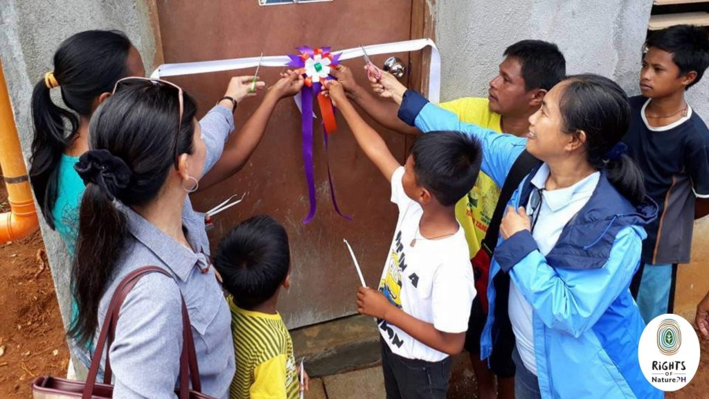 ribbon cutting for housing program - rights of nature Philippines