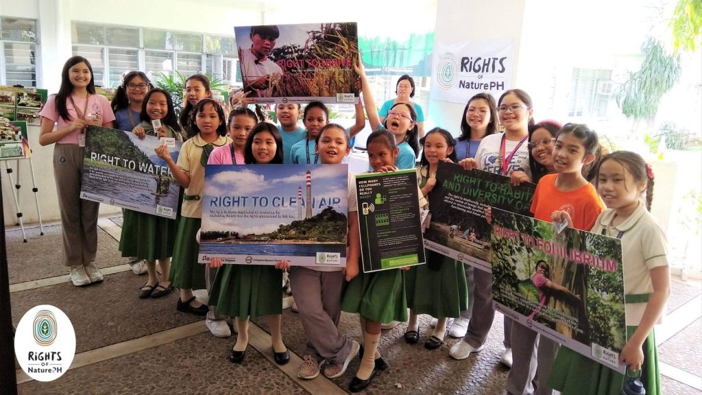children holding posters of rights of nature